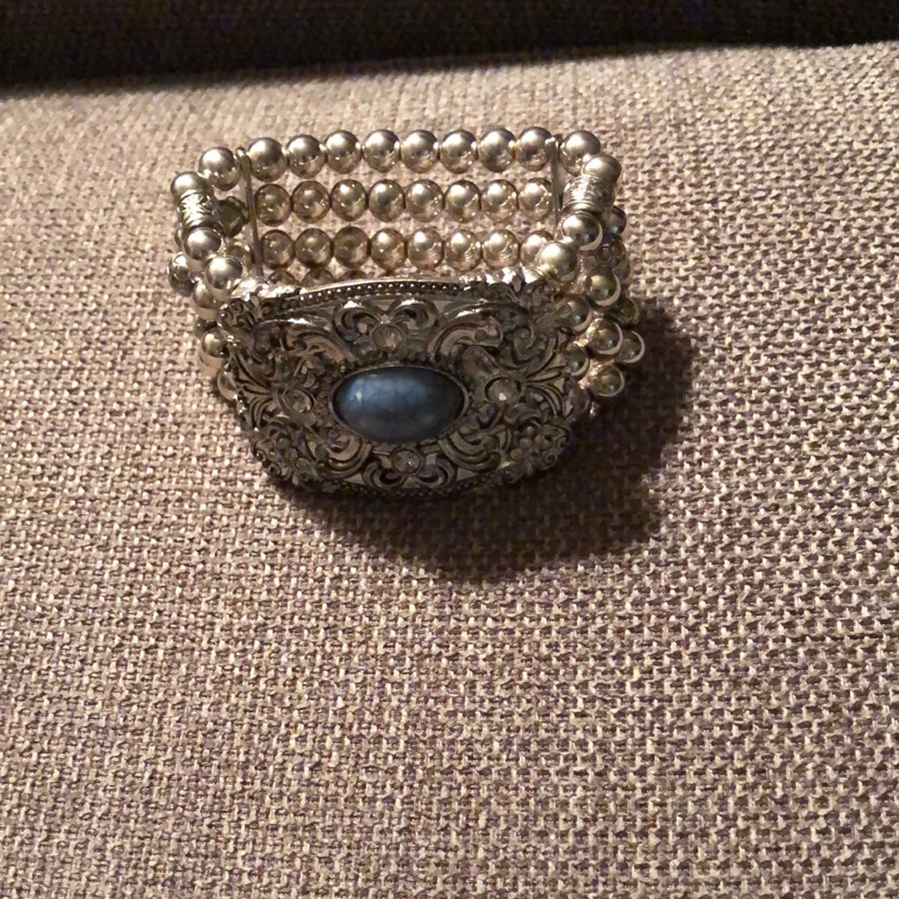 Intricate Silver and Blue Gemstone Bracelet